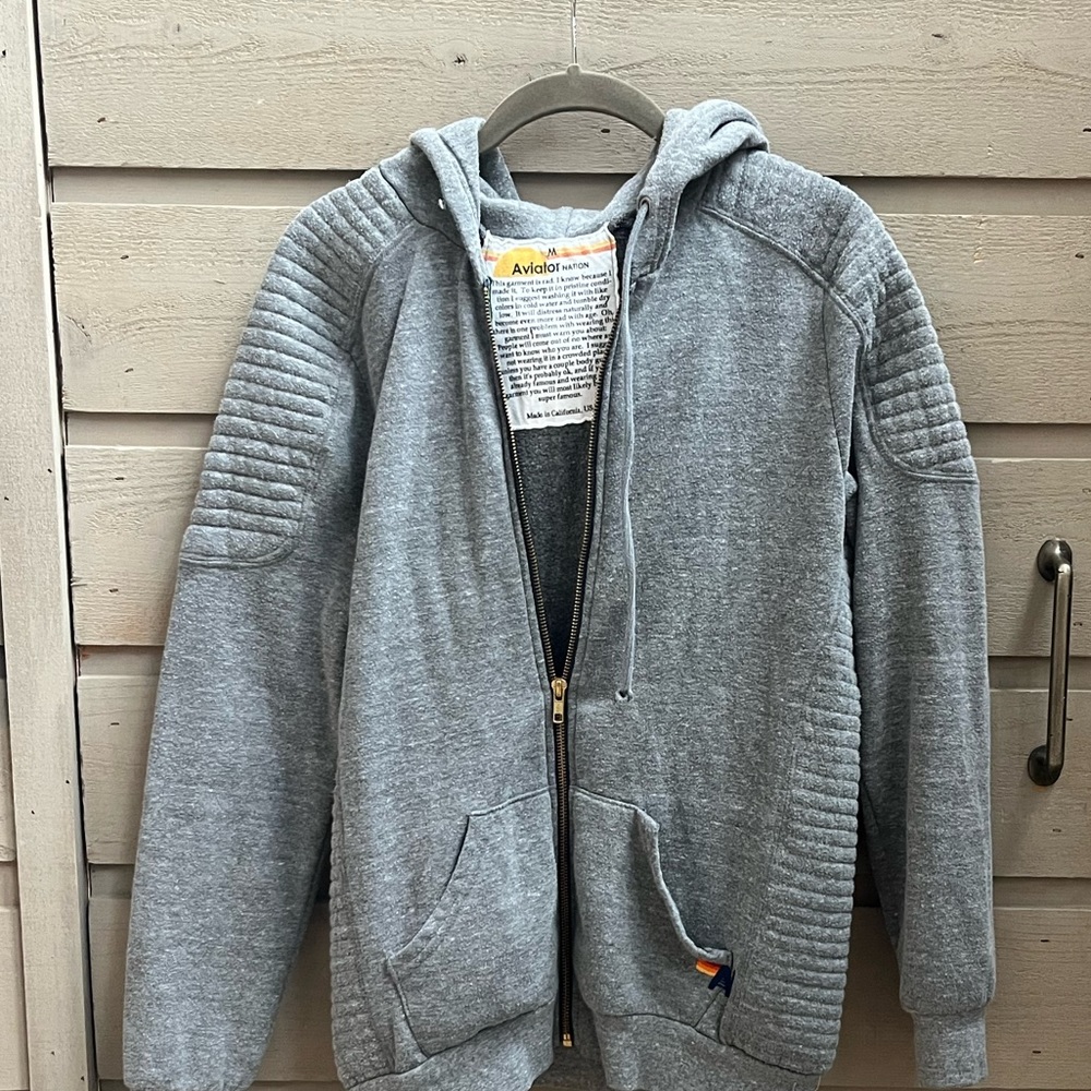 Moto size m. My teenage son wore it but it can also fit a smaller person.